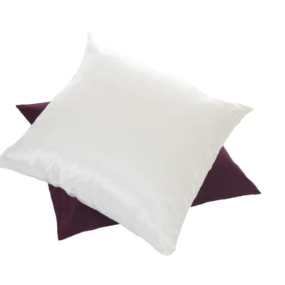 Two pillow cases, one off-white and the other one burgundy