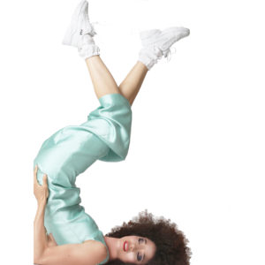 woman playing and wearing white silk socks and long green silk dress